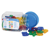 The product packaging for Transparent Numbers is on its side with the lid askew. The colorful numnbers in the set are spilling out of the package.