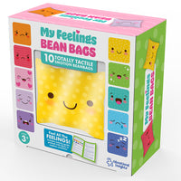 A colorful product box labeled "My Feelings Bean Bags" with a yellow smiley bean bag peeking out of a transparent  window and illustrations of the entire set on either side.
