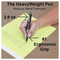 A hand with light skin tone holds the Heavyweight Ball Pen over a yellow legal pad as though writing.