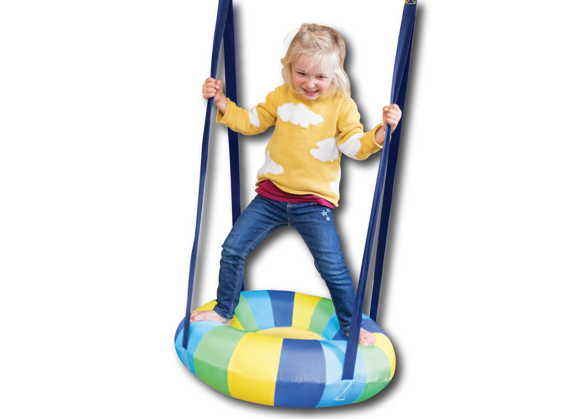 A child with light skin tone and blonde hair stands on top of the Cloud Swing. They are standing on the edges of the inflatable seat and holding onto two straps.