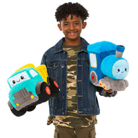 A child with dark skin tone and short black curly hair is holding the Squishable GO! Train in their elft hand but also a different Squishable in their right.