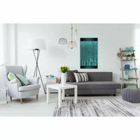 The 3 Ft. Bubble Wall hangs above a sleek grey couch in a modern living room.