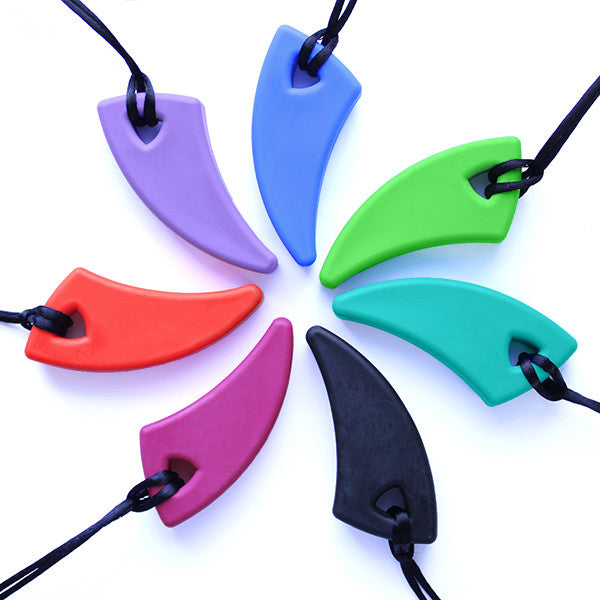 The variety of colors of the Saber Tooth Chewable Necklace in a circle.