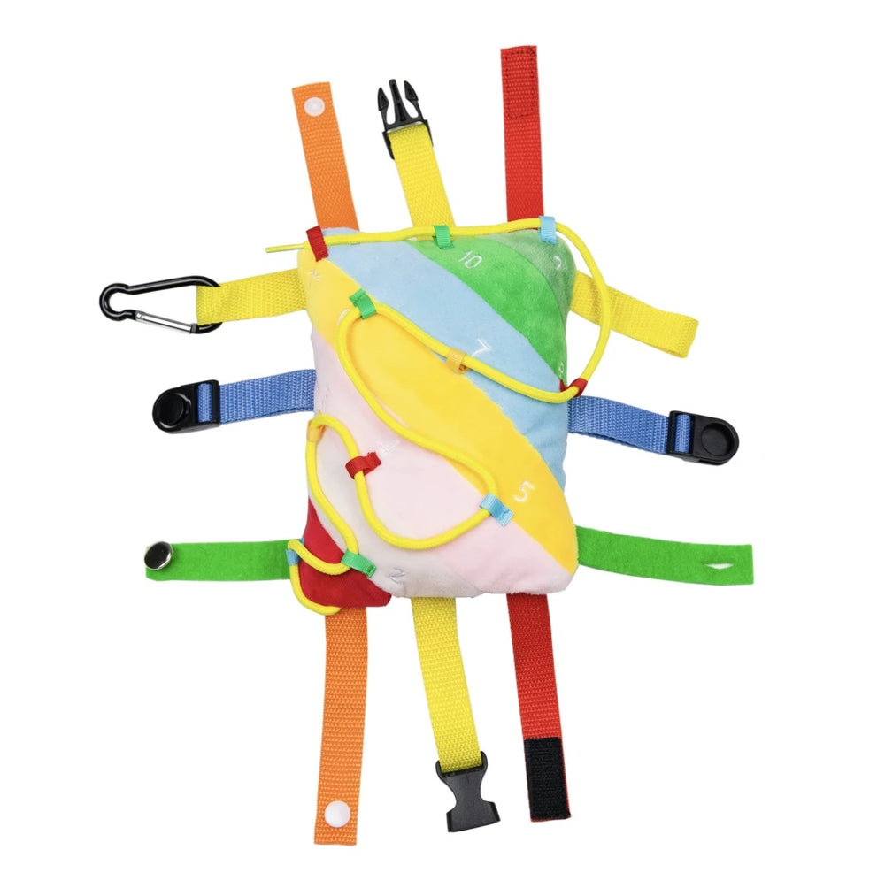The Thingamajig Activity Sensory PIllow with all of the buckles and snaps undone.