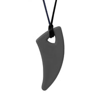 A dark grey Saber Tooth Chewable Necklace.