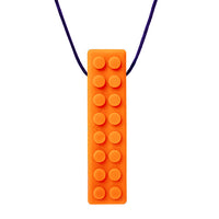 The orange Brick Stick Chew Necklace.