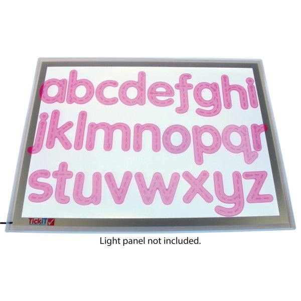 The SiliShapes Trace Alphabet displayed on top of a light panel (not included).