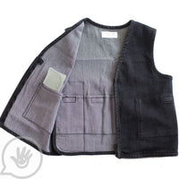 A view of the pockets for the weights in the Weighted Stretch Denim Vest.
