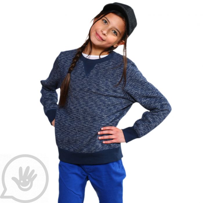 A child with light skin and a long dark brown braid is standing with their hands on their hips. They are wearing the Denim Weighted Baseball Cap.