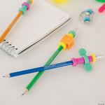 Pencil Pushers posed on a desktop with a pad of paper and a ring fidget.