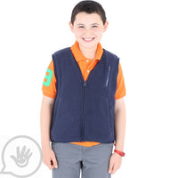 A child with light skin tone and short brown hair is wearing a Weighted Fleece Vest over a button up shirt.