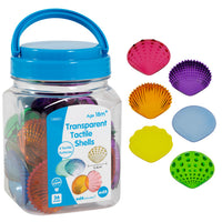 The product package for Transparent Tactile Shells next to six multicolored, differently textured Transparent Tactile Shells.