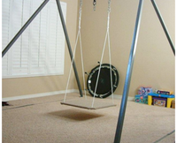 A Very Large Frame with a Platform Swing hanging from it.